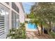 Charming backyard view with pool, lush plants, trees, and stone pathway; creating a peaceful outdoor retreat at 53 Grossinger Ct, Henderson, NV 89074