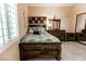 This comfy bedroom is well-lit, featuring a wooden bed frame, sleek nightstands, and stylish wall decor at 53 Grossinger Ct, Henderson, NV 89074