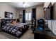 This nice bedroom features a sleek design, with a modern gamer setup and comfortable sleeping space at 53 Grossinger Ct, Henderson, NV 89074