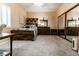 Bright bedroom featuring a large bed, a mirrored closet, and a set of matching wood furniture at 53 Grossinger Ct, Henderson, NV 89074