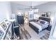 Bright bedroom featuring wood floors, large window, and a decorative mirror at 53 Grossinger Ct, Henderson, NV 89074