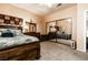 Well-lit bedroom includes stylish wood furniture, soft neutral carpet, and a large mirrored closet at 53 Grossinger Ct, Henderson, NV 89074