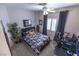 Comfortable bedroom with stylish furnishings, a ceiling fan, a sleek desk setup and natural light at 53 Grossinger Ct, Henderson, NV 89074