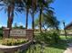 Legacy Highlands community sign with beautiful flowers and lush trees, set against a bright blue sky at 53 Grossinger Ct, Henderson, NV 89074