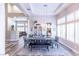 Bright dining room featuring wood floors, modern lighting, and shuttered windows at 53 Grossinger Ct, Henderson, NV 89074
