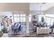 Open concept living space with natural light, fireplace, and a large dining table set at 53 Grossinger Ct, Henderson, NV 89074