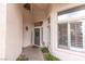 Inviting entryway with sidelight windows, decor, and a light gray front door at 53 Grossinger Ct, Henderson, NV 89074