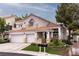 Charming two-story home featuring a three-car garage, tiled roof, and well-maintained landscaping at 53 Grossinger Ct, Henderson, NV 89074