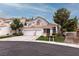 Home featuring a tile roof, mature trees and landscaping and a three-car garage at 53 Grossinger Ct, Henderson, NV 89074