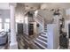 Grand foyer featuring a staircase, high ceilings, and wood-look flooring at 53 Grossinger Ct, Henderson, NV 89074