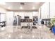 Spacious kitchen featuring white cabinets, stainless steel appliances, and granite countertops at 53 Grossinger Ct, Henderson, NV 89074
