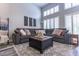 Spacious living room with a large sectional sofa, high ceilings, and ample natural light at 53 Grossinger Ct, Henderson, NV 89074