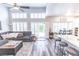 Open-concept living room with high ceilings and a sliding glass door to outdoor living space at 53 Grossinger Ct, Henderson, NV 89074