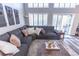 Comfortable living room with sectional sofa, bright windows, and decorative accents at 53 Grossinger Ct, Henderson, NV 89074