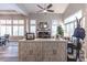 Bright and airy living room with a fireplace and large windows with plantation shutters at 53 Grossinger Ct, Henderson, NV 89074
