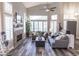 Bright living room featuring vaulted ceilings, wood floors, fireplace and lots of natural light at 53 Grossinger Ct, Henderson, NV 89074