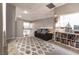 Cozy loft area with comfortable seating, stylish rug, and a built-in bookcase, perfect for relaxing and reading at 53 Grossinger Ct, Henderson, NV 89074