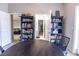 Office space with black shelving and a view into a living room and hallway at 53 Grossinger Ct, Henderson, NV 89074