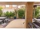 Secluded outdoor patio featuring comfortable seating and lush landscaping at 53 Grossinger Ct, Henderson, NV 89074