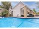 Backyard pool featuring a covered patio with lounge furniture and a manicured lawn at 53 Grossinger Ct, Henderson, NV 89074