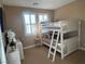 Bedroom with a bunk bed, carpeted floors, shutters, and a ceiling light at 530 Calahonda Ct, Las Vegas, NV 89138