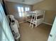 Comfortable bedroom with a bunk bed, carpeted floors, shutters, and a ceiling light at 530 Calahonda Ct, Las Vegas, NV 89138