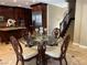 Kitchen and dining area with dark cabinetry and a view of the staircase to the second floor at 530 Calahonda Ct, Las Vegas, NV 89138