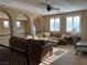 Second floor living room features a comfortable sectional sofa, lots of windows and lots of natural light at 530 Calahonda Ct, Las Vegas, NV 89138