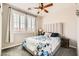 This bedroom features shutters, carpet and a ceiling fan at 5920 Big Horn View St, North Las Vegas, NV 89031