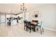 Cozy dining area adjacent to the kitchen, featuring a round table and stylish chandelier at 5920 Big Horn View St, North Las Vegas, NV 89031