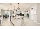 Modern kitchen features an island, stainless steel appliances, and a seamless open floor plan at 5920 Big Horn View St, North Las Vegas, NV 89031