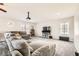 The living room has neutral carpet and paint with a projector at 5920 Big Horn View St, North Las Vegas, NV 89031