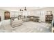 Living room features a large sectional sofa, and carpeted floors at 5920 Big Horn View St, North Las Vegas, NV 89031