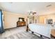 Well-lit main bedroom with a decorative wooden bed frame, neutral walls, and a cozy carpet at 5920 Big Horn View St, North Las Vegas, NV 89031
