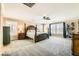 Expansive main bedroom with a decorative four-poster bed, neutral walls, and shuttered windows at 5920 Big Horn View St, North Las Vegas, NV 89031