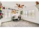 Bright office space with a ceiling fan and windows, providing a productive and comfortable atmosphere at 5920 Big Horn View St, North Las Vegas, NV 89031
