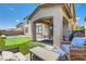 Charming outdoor patio with comfortable seating, ideal for relaxing and entertaining guests at 5920 Big Horn View St, North Las Vegas, NV 89031