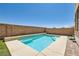 Inviting private pool with tiled accents surrounded by concrete and a privacy wall, perfect for relaxation at 5920 Big Horn View St, North Las Vegas, NV 89031