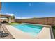 Backyard featuring pool with brick wall and covered outdoor seating at 5920 Big Horn View St, North Las Vegas, NV 89031