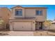 Inviting two-story home featuring a tile roof, two-car garage and a neatly landscaped front yard at 6713 Violet Cascade Ave, Las Vegas, NV 89156