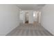 Upstairs hallway featuring neutral carpeting and access to multiple rooms at 6713 Violet Cascade Ave, Las Vegas, NV 89156