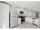Bright kitchen showcasing modern appliances and abundant counter space for food prep at 6719 Violet Cascade Ave, Las Vegas, NV 89156