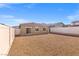Spacious backyard fully enclosed with vinyl fencing and a low-maintenance gravel ground cover at 6737 Lotus Vista Ct, Las Vegas, NV 89156