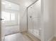 Clean bath featuring tile shower with hard surface floors, adjoining view of bedroom at 6737 Lotus Vista Ct, Las Vegas, NV 89156