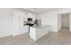Modern kitchen with white cabinets, stainless steel appliances, and a convenient island at 6737 Lotus Vista Ct, Las Vegas, NV 89156