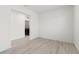 Blank canvas featuring hard surface floors with adjoining view of laundry area at 6737 Lotus Vista Ct, Las Vegas, NV 89156