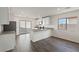 Bright eat-in kitchen featuring stainless steel appliances, white cabinetry and backyard access at 6743 Violet Cascade Ave, Las Vegas, NV 89156