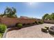 Well-maintained backyard featuring a brick-paved area, green foliage, and seating arrangements at 7349 Royal Melbourne Dr, Las Vegas, NV 89131