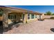 Expansive backyard boasts a covered patio, dining set, swing, and brick-paved space at 7349 Royal Melbourne Dr, Las Vegas, NV 89131