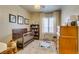 Cozy Bedroom with a dark wood crib, a patterned rug, a bookshelf and a window at 7349 Royal Melbourne Dr, Las Vegas, NV 89131